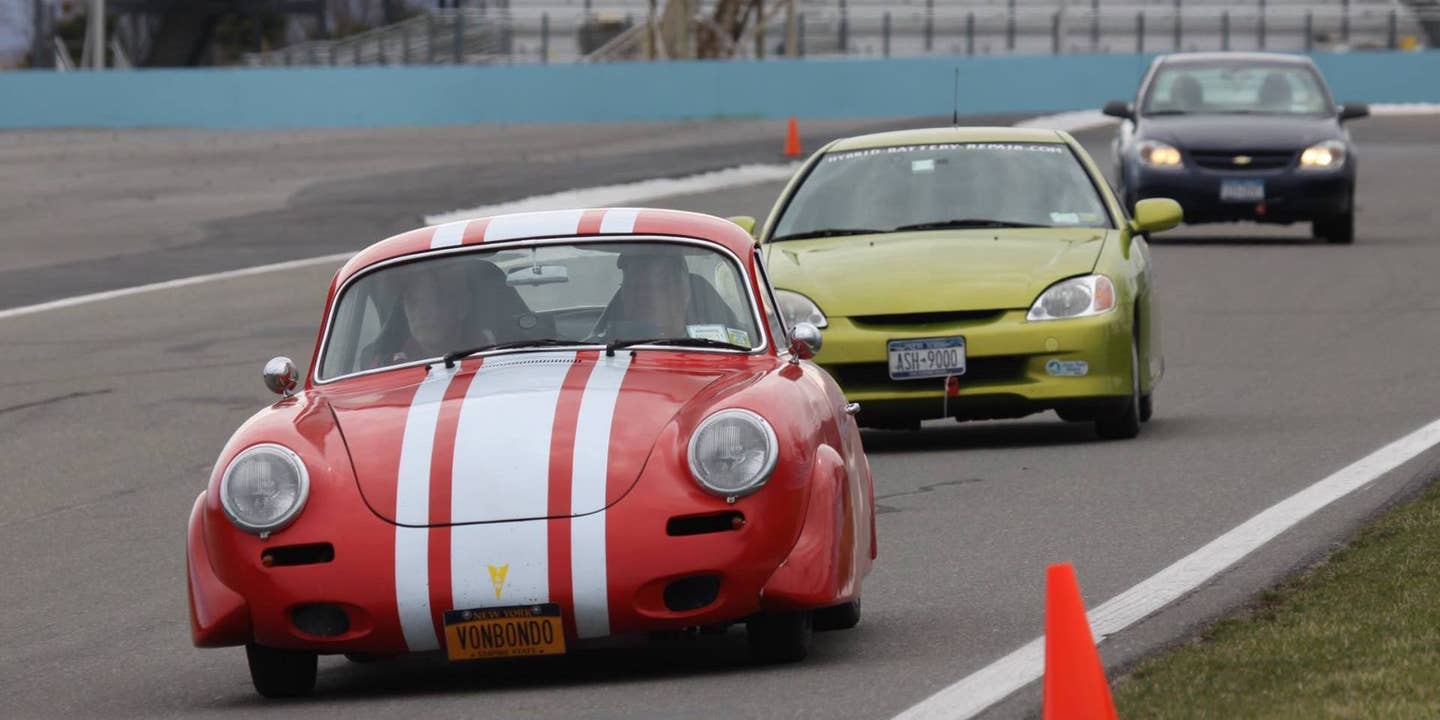 A classic Porsche tailed by a Honda Insight at the Toyota Green Grand Prix