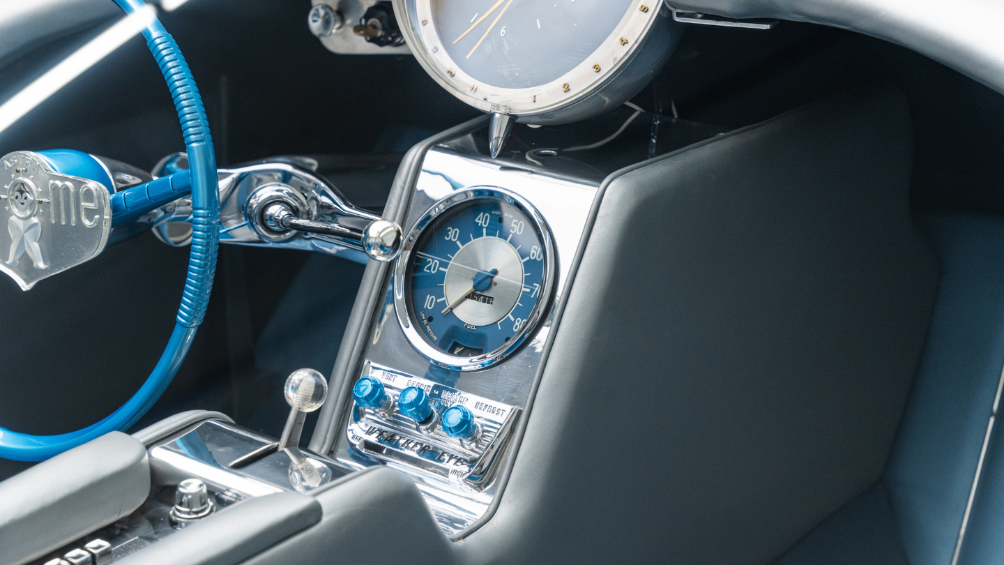 silver and blue car gauges