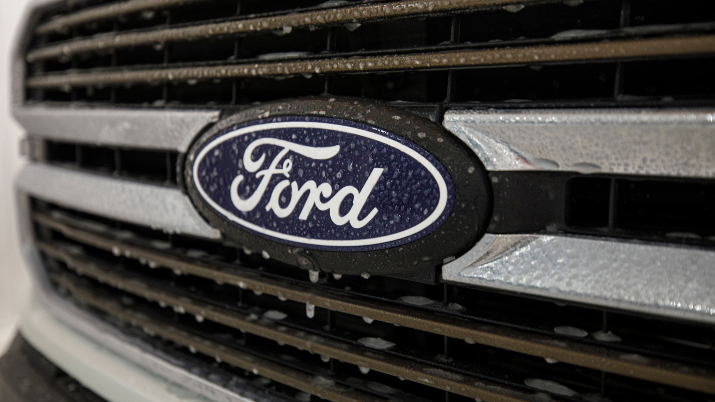 truck grille with a blue Ford badge