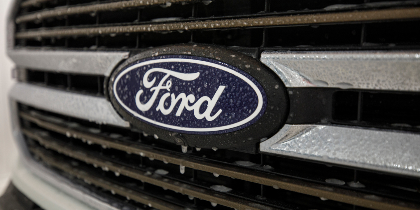 truck grille with a blue Ford badge