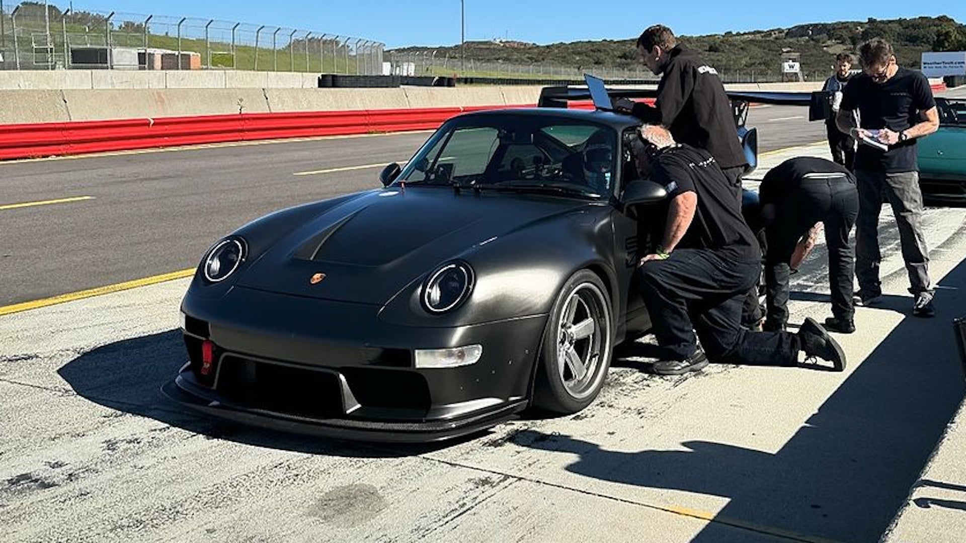Driver escapes unscathed from rollover in Gunther Werks Porsche 911 Turbo prototype at Laguna Seca.