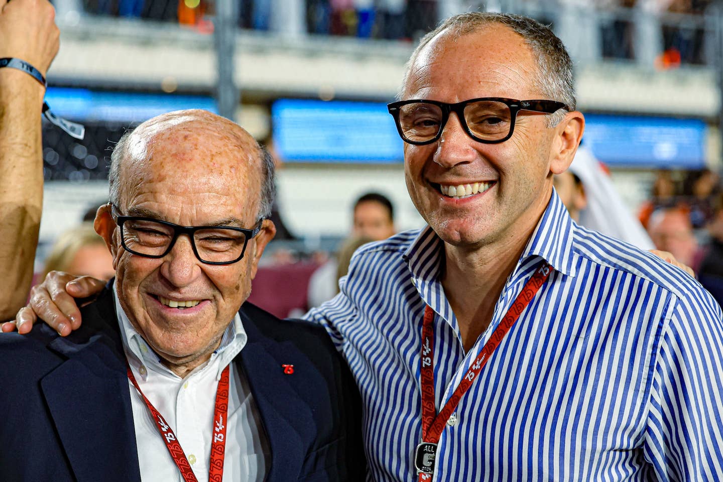 CEO of Dorna Sports Carmelo Ezpeleta and F1 CEO Stefano Domenicali on the grid before the start of the MotoGP Grand Prix of Qatar. <em>Getty Images</em>