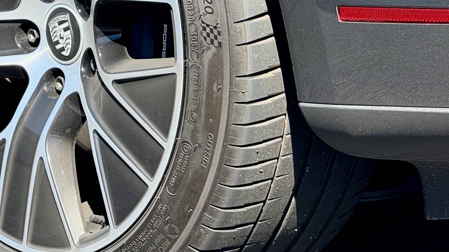 A rear tire from a Porsche Taycan showing even wear after lapping at Sonoma Raceway.
