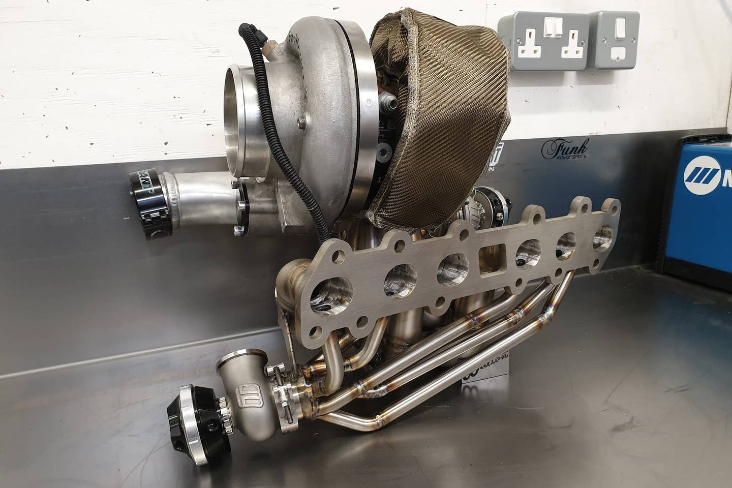 Walton Motorsports 2JZ-GTE exhaust manifold with fresh air anti-lag