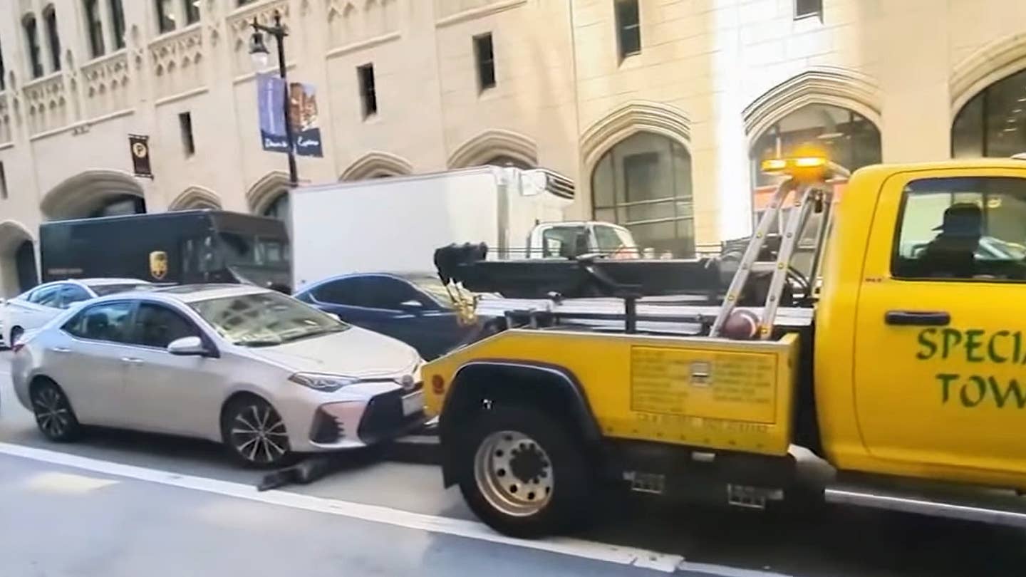 A Shady Tow Truck Tried to Haul Away a Moving Car, Then Chased After It