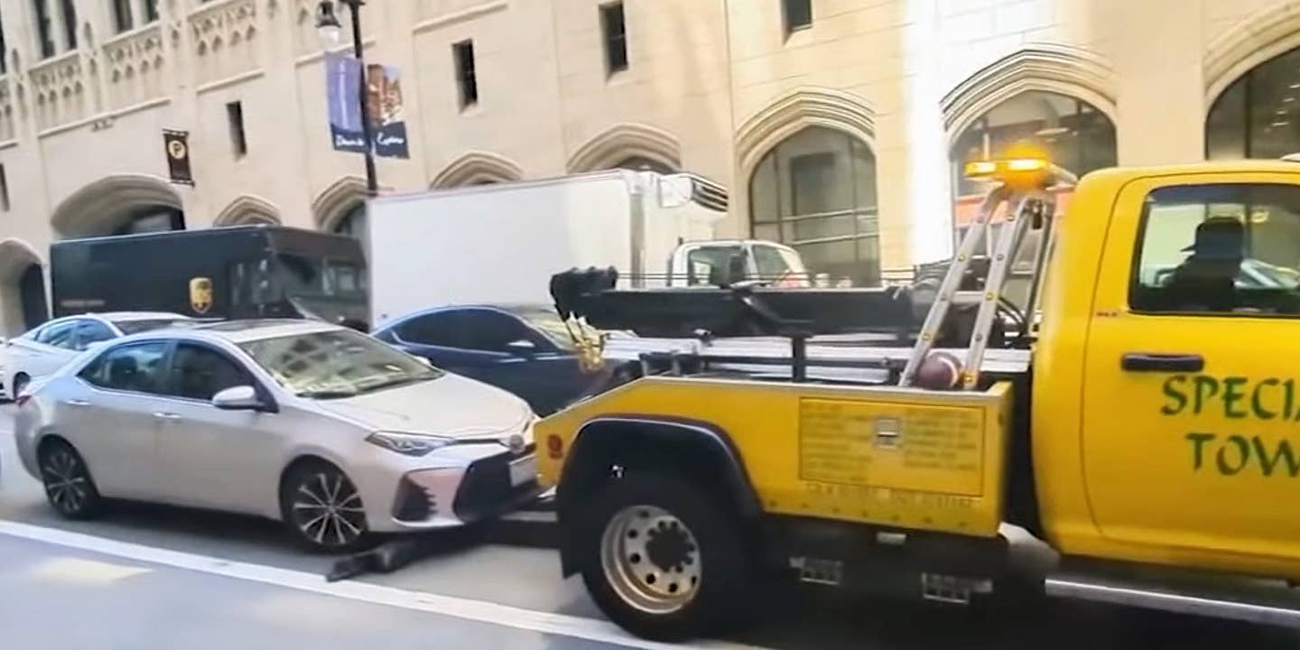 A Shady Tow Truck Tried to Haul Away a Moving Car, Then Chased After It