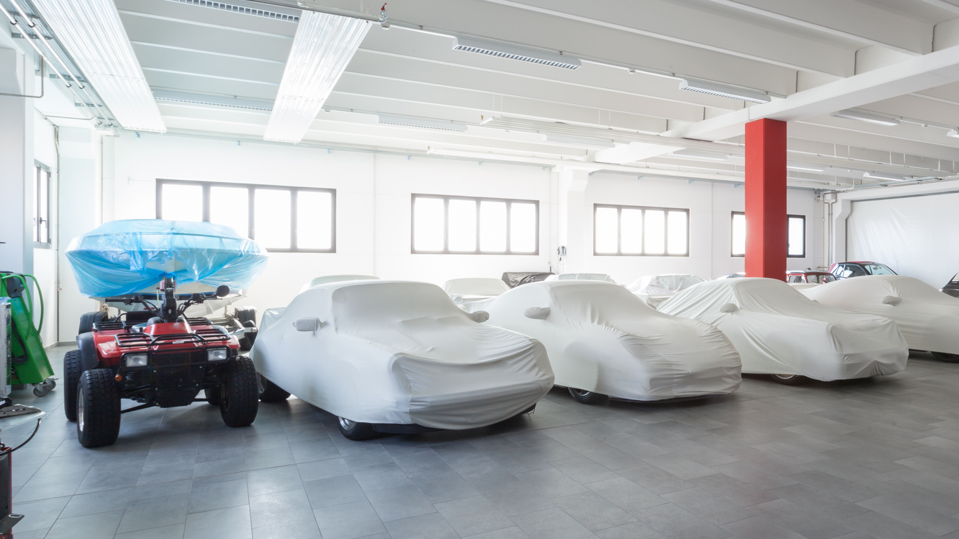 A collection of vehicles in a very nice garage.