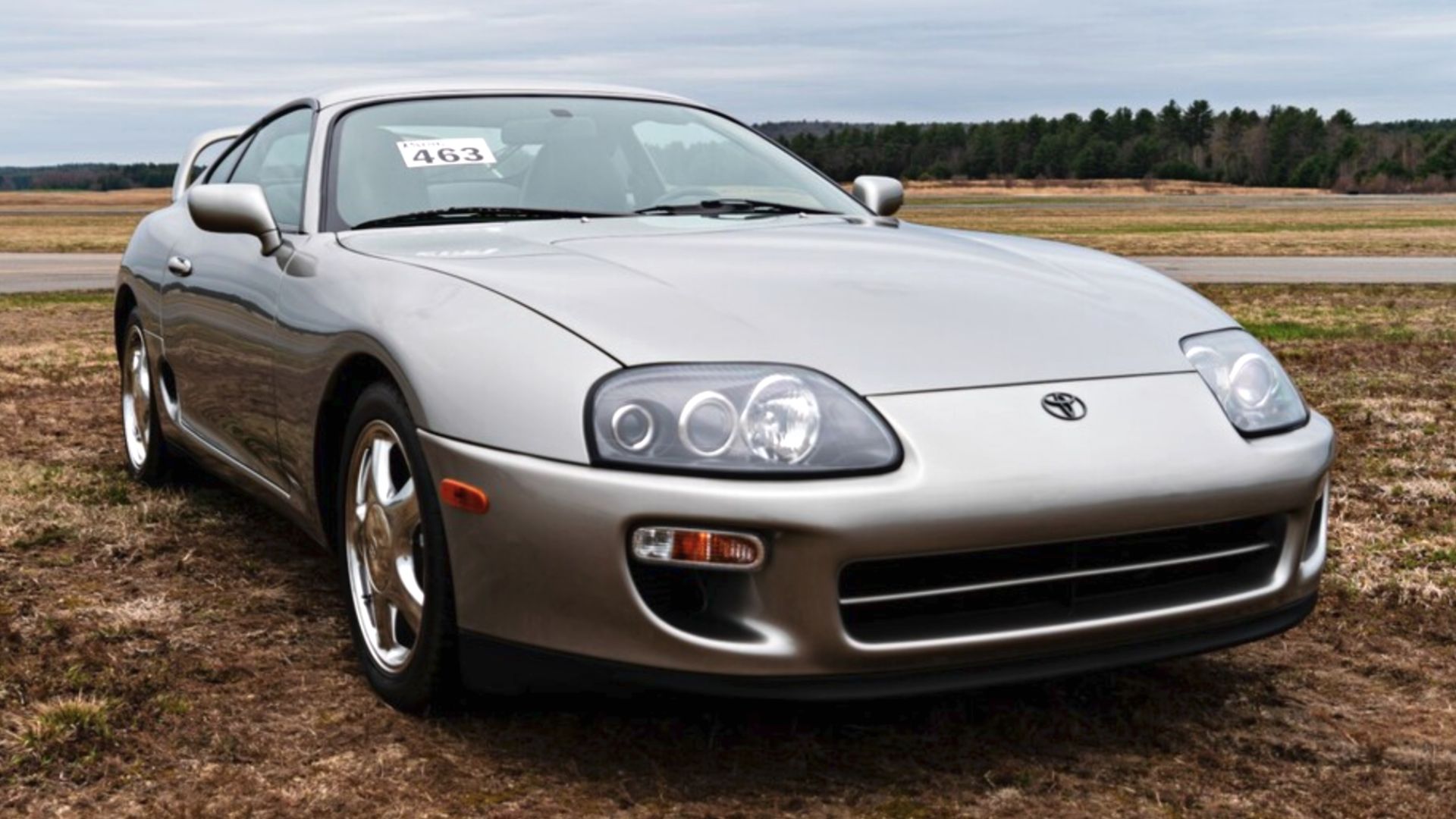 Silver Toyota Supra in field