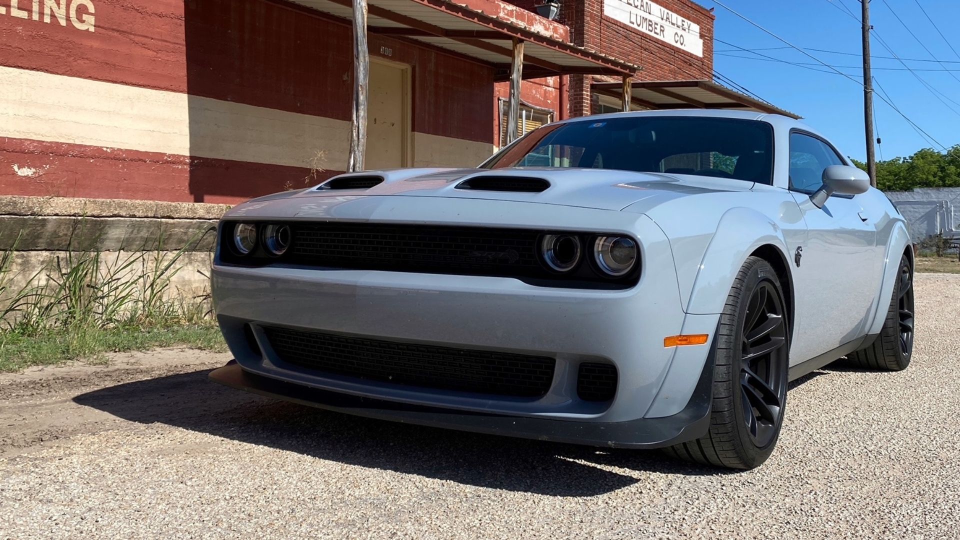 gray car in front of red pecan factory