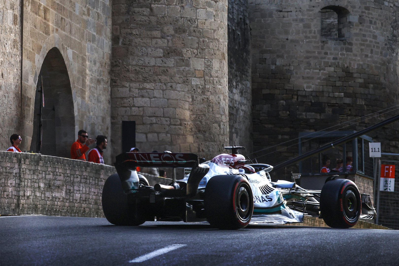 George Russell's Mercedes car driving through Baku's castle section