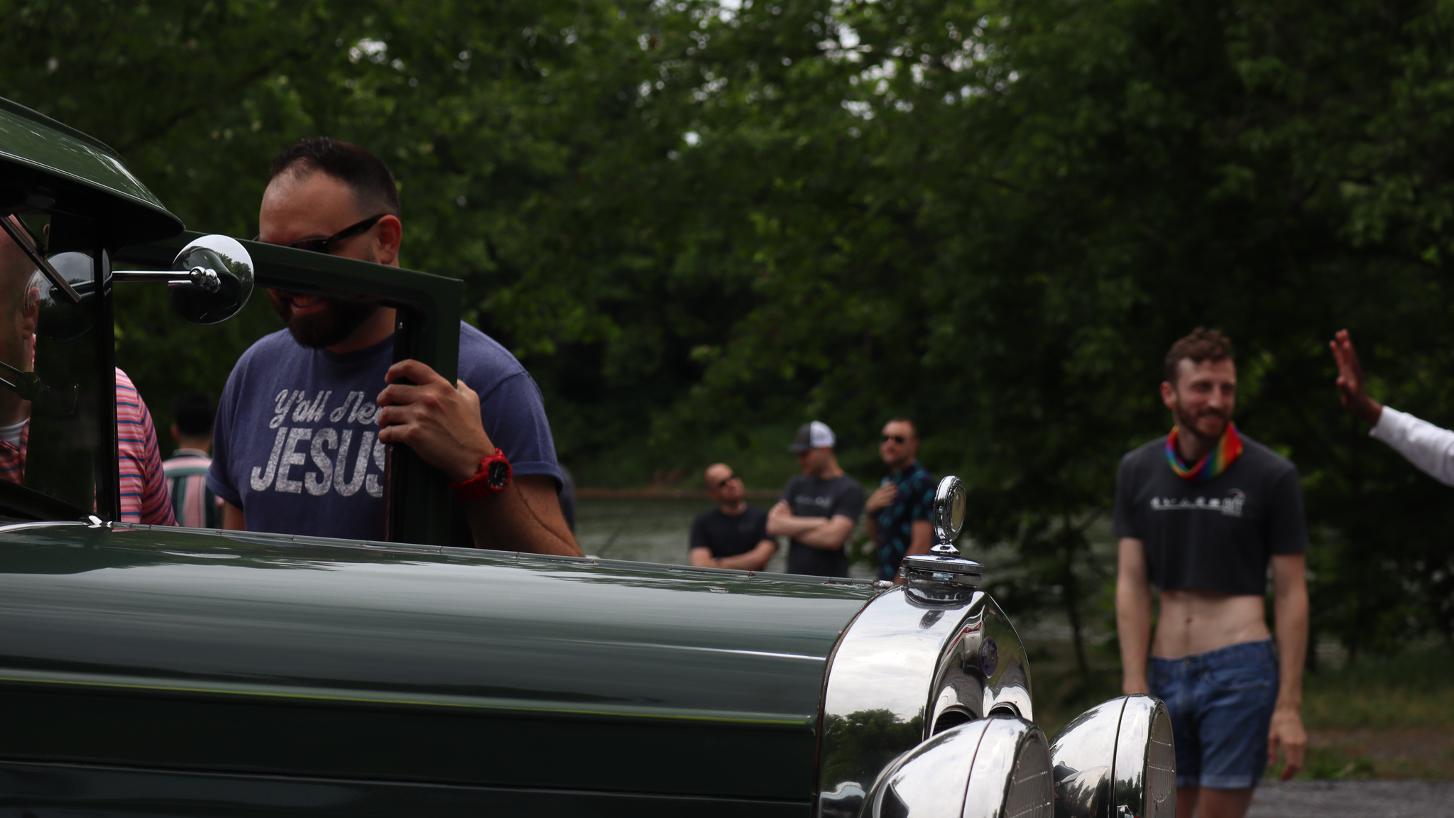 Model A next to a gaggle of gays