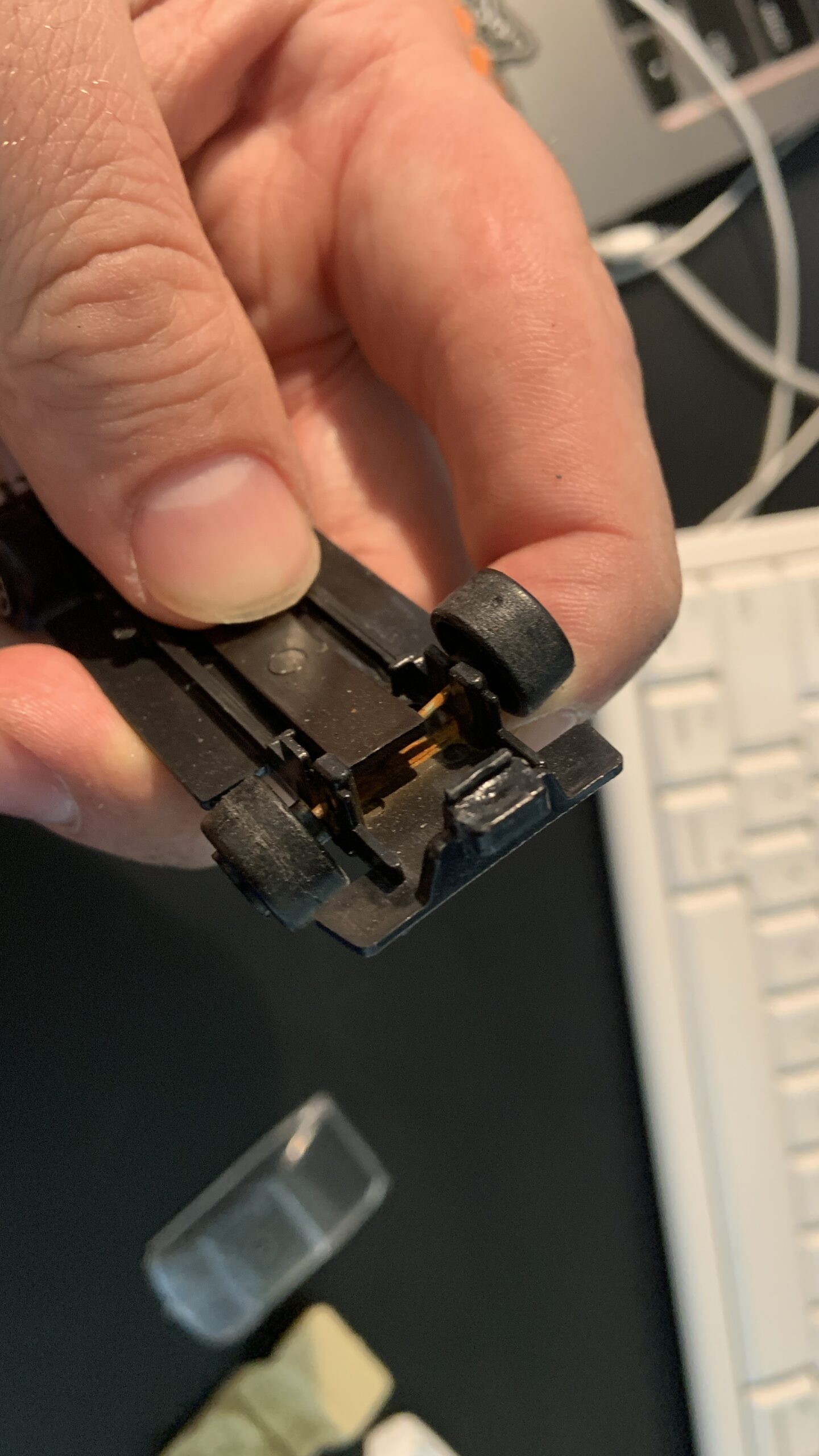 Hot Wheels car axle removal.