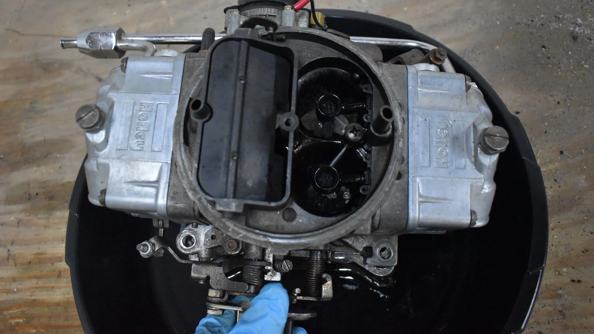 Emptying the liquid in a carb into a pan.