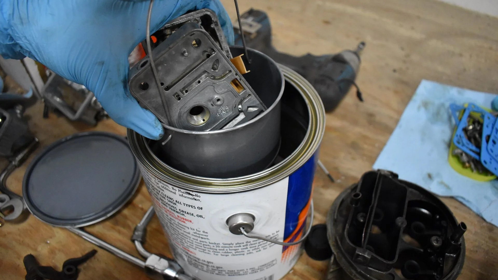 Dipping part of the carb in a chemical bath.