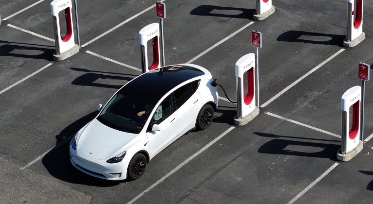 A Tesla Model Y charges at a Supercharger in California.