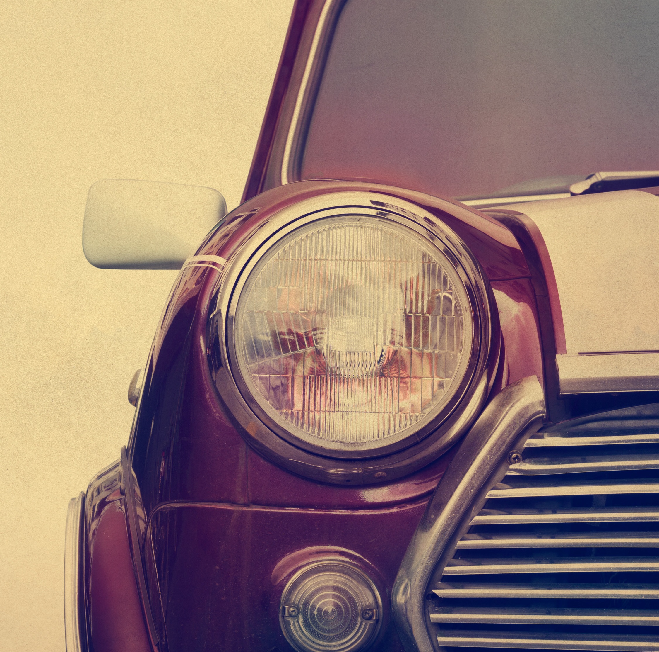 Retro car head light on paper grain background, vintage color tone