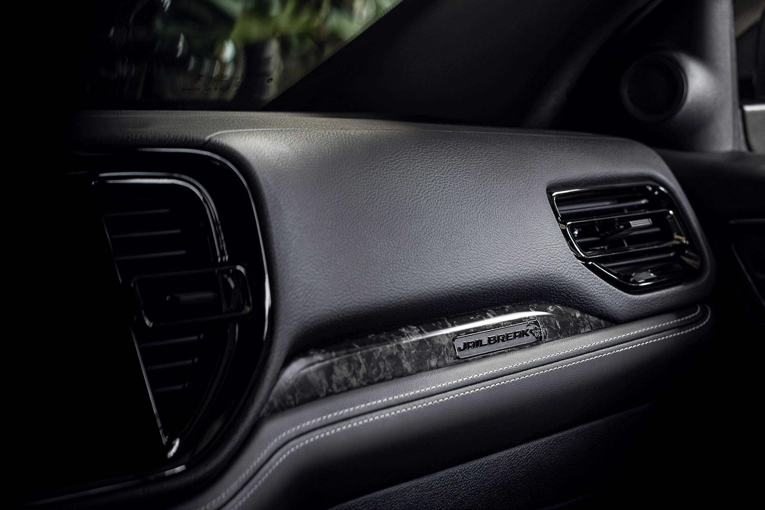 2026 Dodge Durango SRT Hellcat Jailbreak models feature an exclusive Jailbreak IP badge stamped into standard carbon-fiber interior appliques.