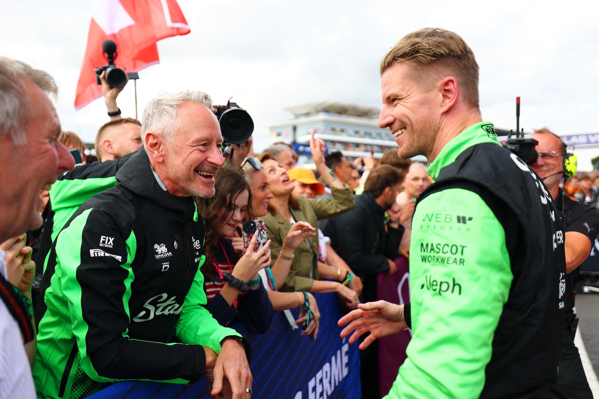 NORTHAMPTON, ENGLAND - JULY 06: Jonathan Wheatley, Team Principal of Stake F1 Team Kick Sauber and Third placed Nico Hulkenberg of Germany and Stake F1 Team Kick Sauber talk in parc ferme during the F1 Grand Prix of Great Britain at Silverstone Circuit on July 06, 2025 in Northampton, England. (Photo by Bryn Lennon - Formula 1/Formula 1 via Getty Images)