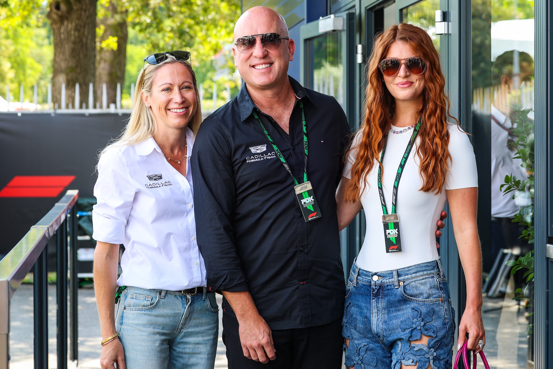 MONZA, ITALY - SEPTEMBER 5: Dan Towriss, CEO of Cadillac F1 Team, Wife Cassidy Towriss and Fiona Hewitson, executive assistant to Dan Towriss pose for a photo in the paddock during practice ahead of the F1 Grand Prix of Italy at Autodromo Nazionale Monza on September 5, 2025 in Monza, Italy. (Photo by Kym Illman/Getty Images)
