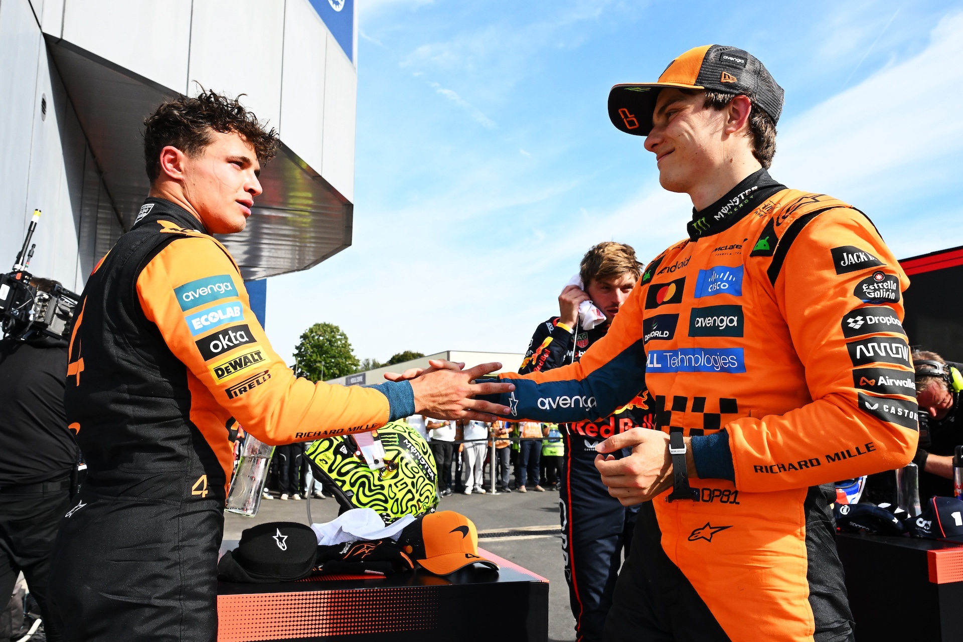 MONZA, ITALY - SEPTEMBER 07: Second placed Lando Norris of Great Britain and McLaren and Third placed Oscar Piastri of Australia and McLaren congralate each other in parc ferme during the F1 Grand Prix of Italy at Autodromo Nazionale Monza on September 07, 2025 in Monza, Italy. (Photo by Mark Sutton - Formula 1/Formula 1 via Getty Images)
