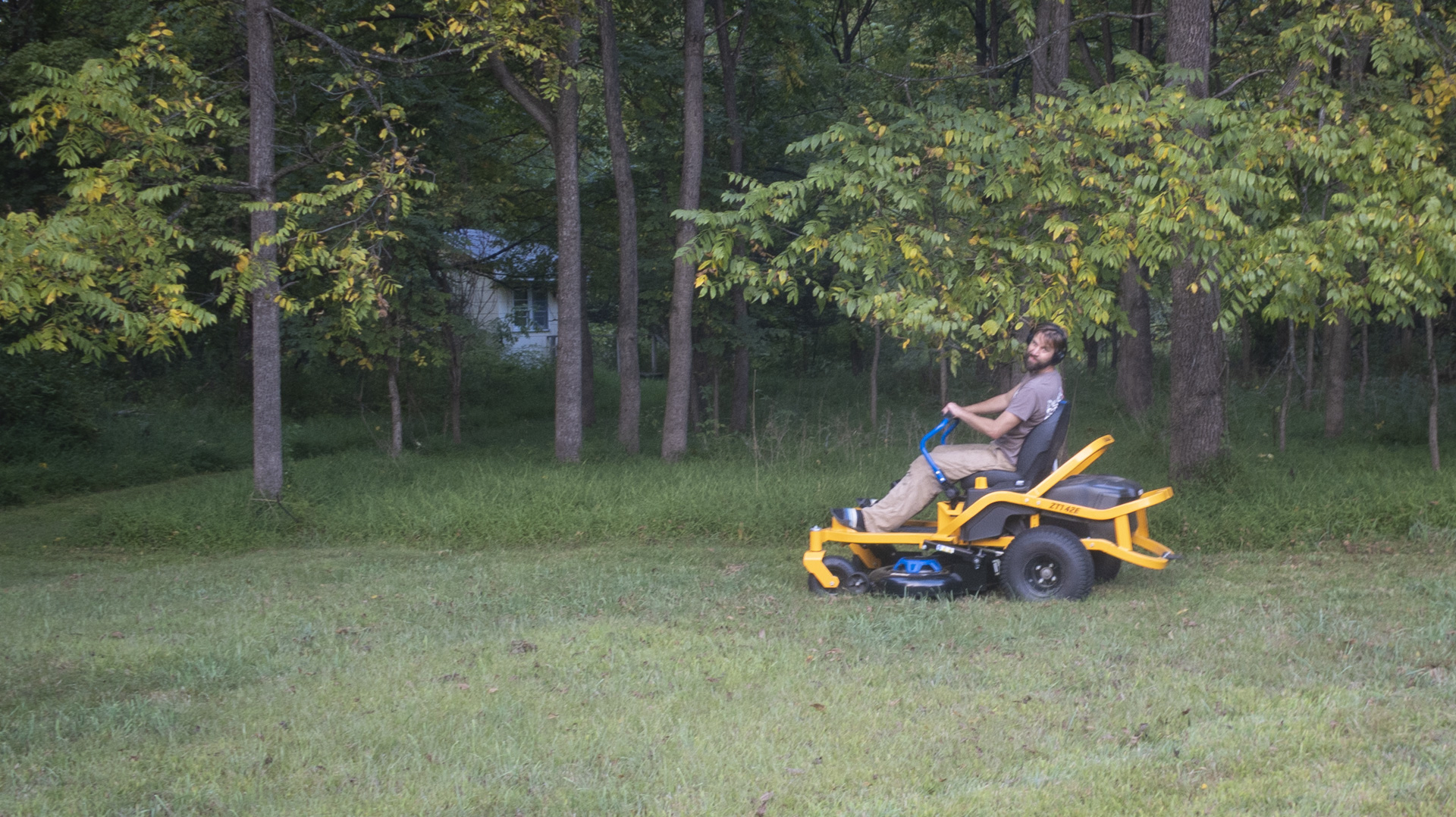 Man hit in the face with a tree branch as he tries to mow a lawn.