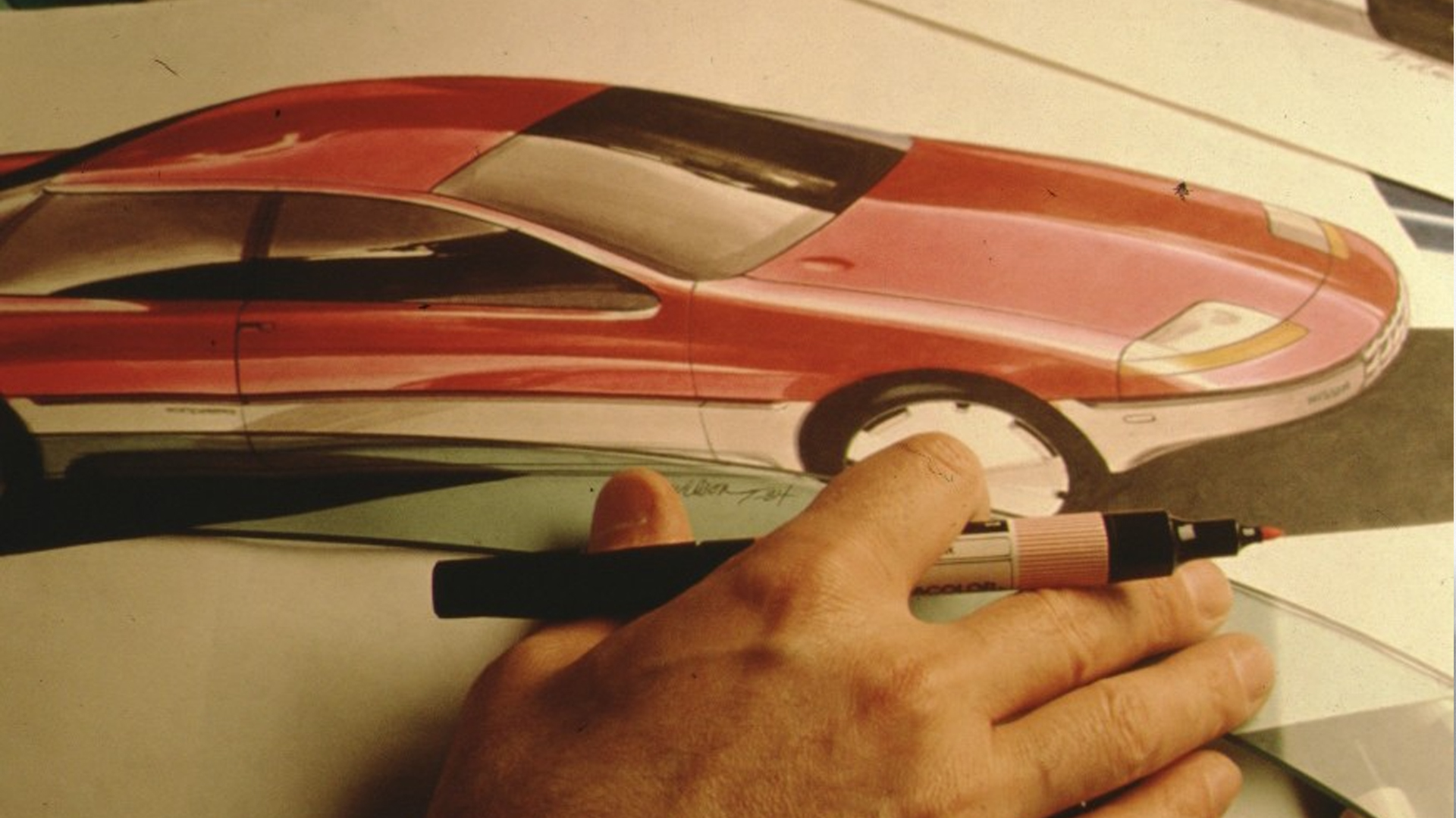 Nissan designer drawing a car.
