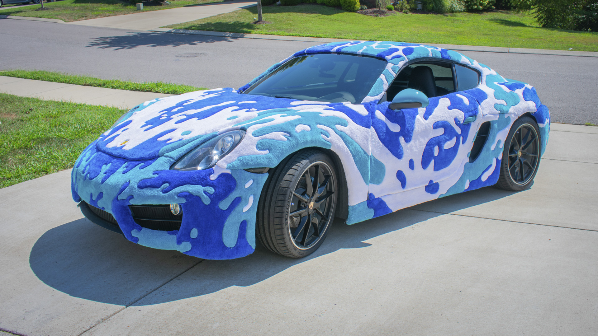 Porsche Cayman wearing a rug.