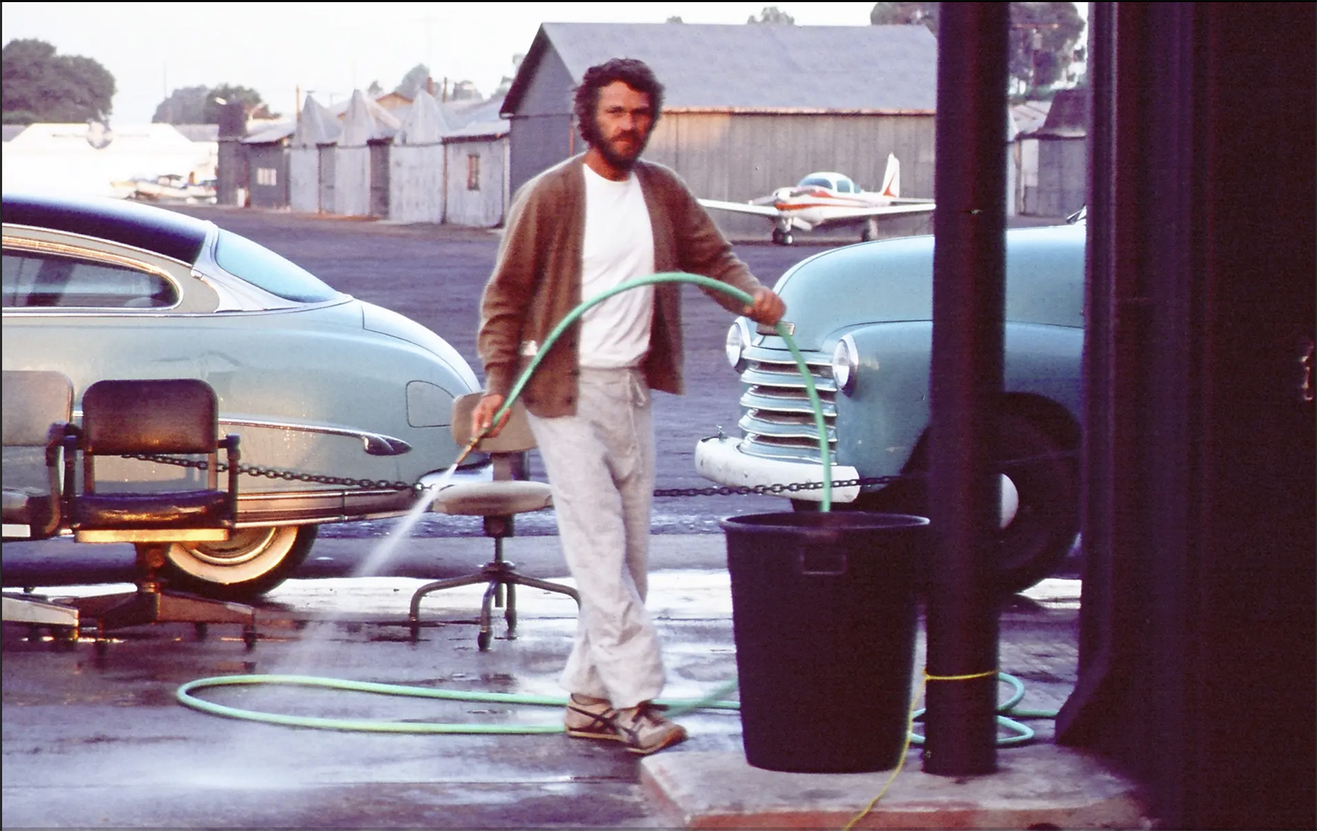 Steve McQueen at Santa Paula airport hangar. You can see the Hudson behind him. Barbara Minty McQueen/RM Sotheby's