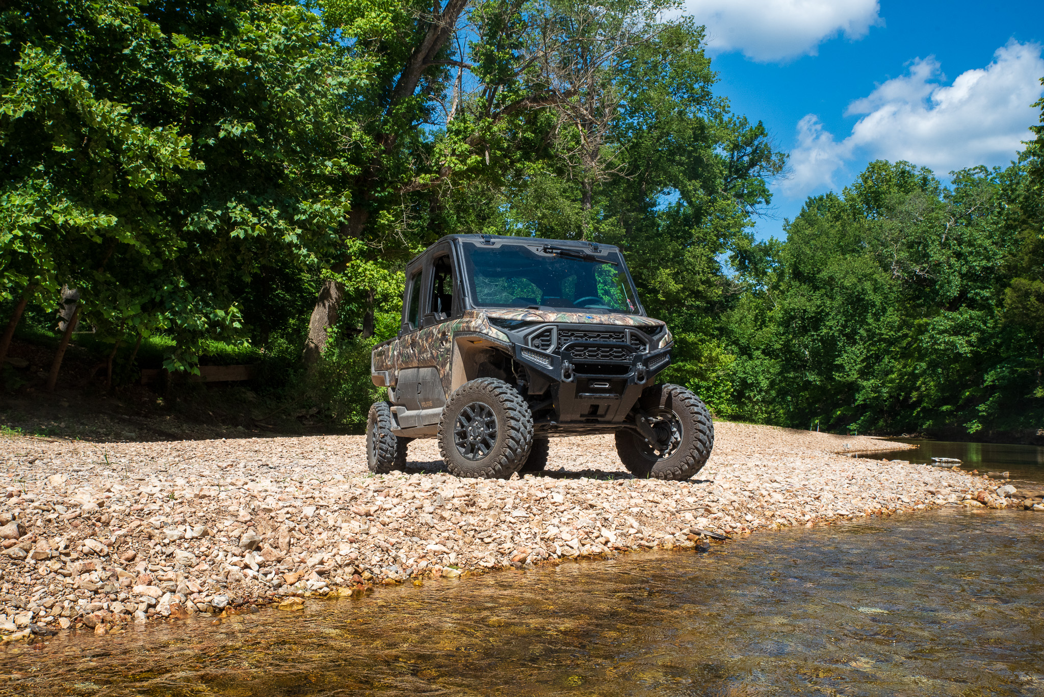 Polaris Ranger XD 1500 posed next to a creek