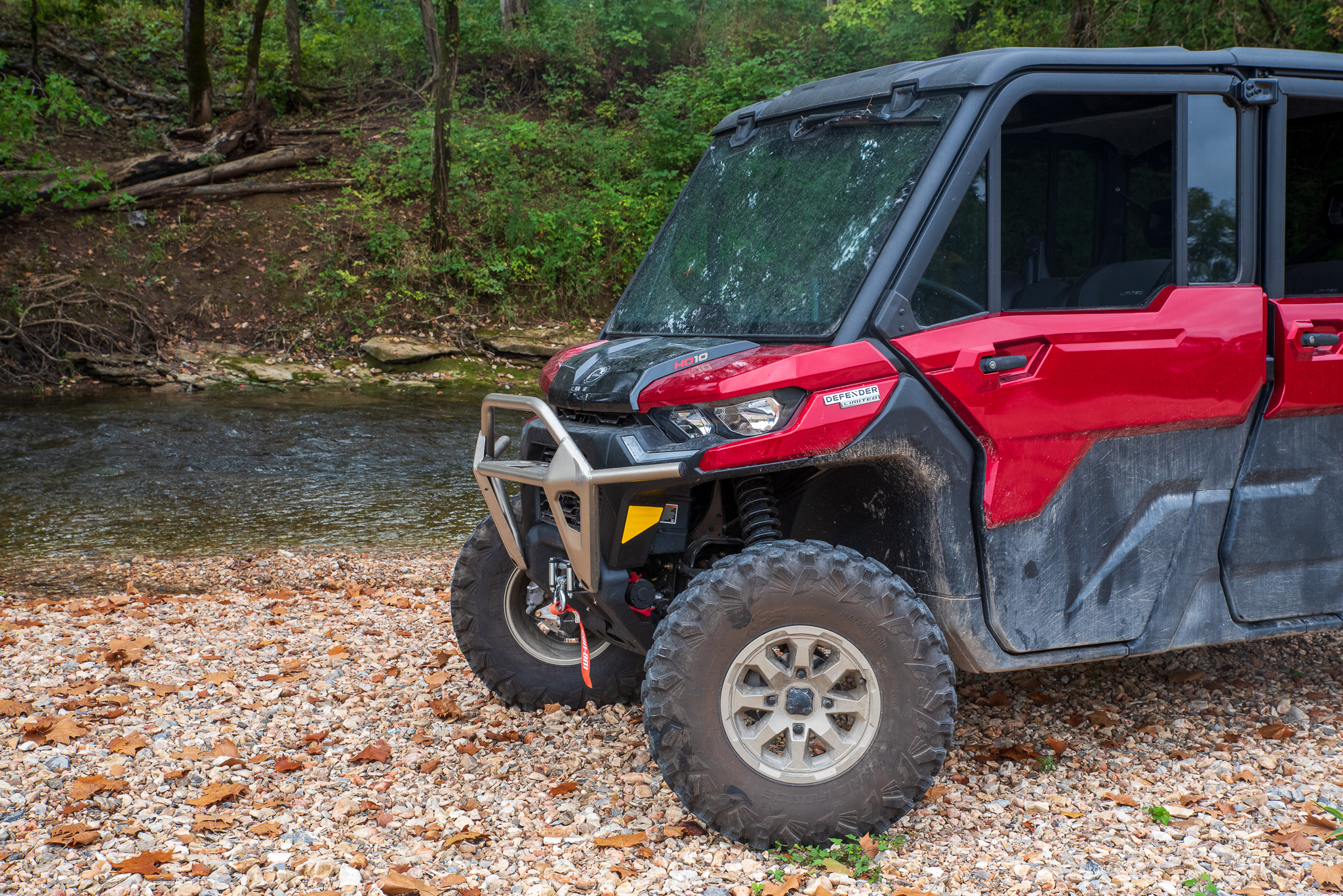 Can-Am Defender Max Limited HD10 parked next to a stream