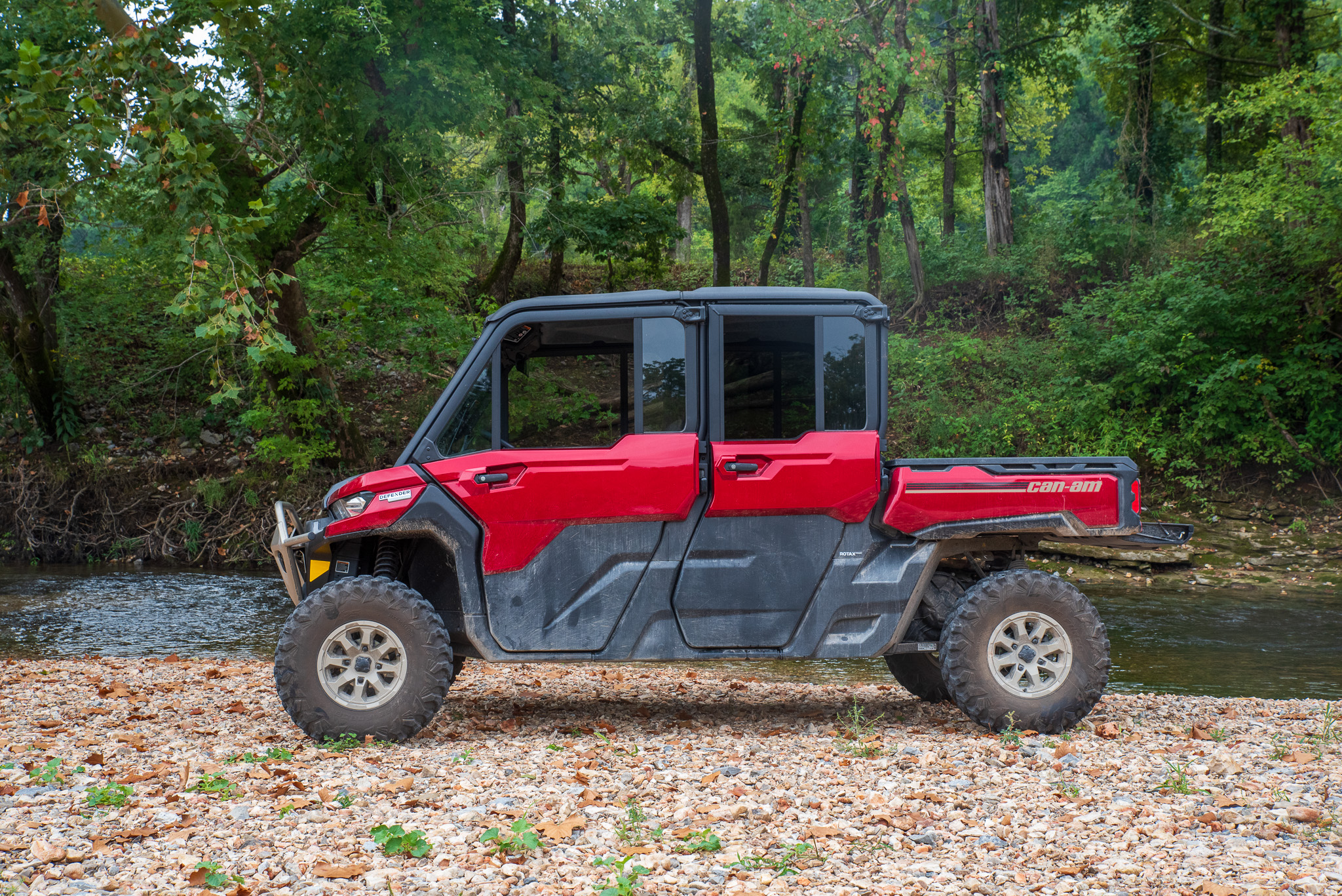 Can-Am Defender Max Limited HD10 parked next to a stream