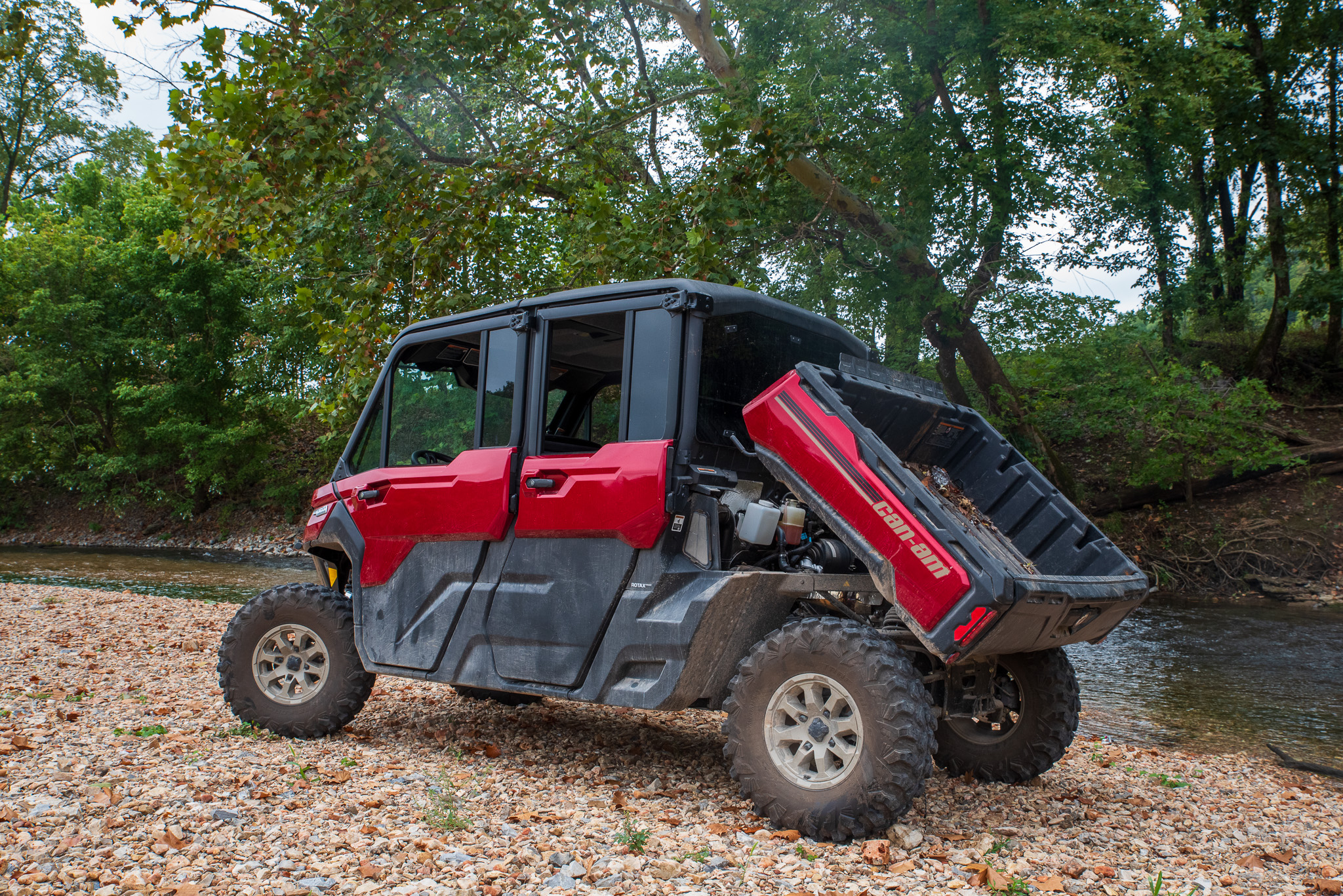 Can-Am Defender Max Limited HD10 parked next to a stream