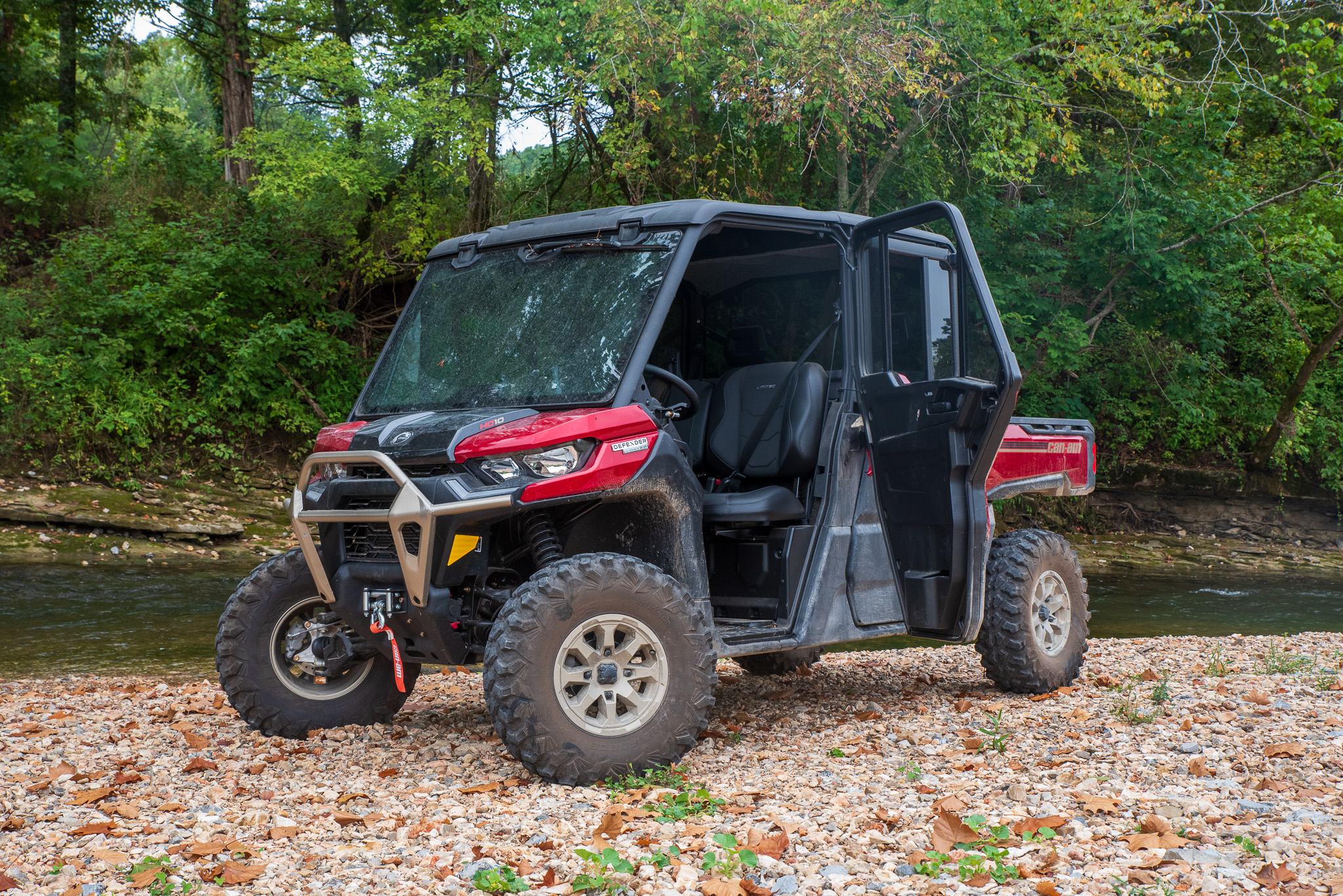 Can-Am Defender Max Limited HD10 parked next to a stream
