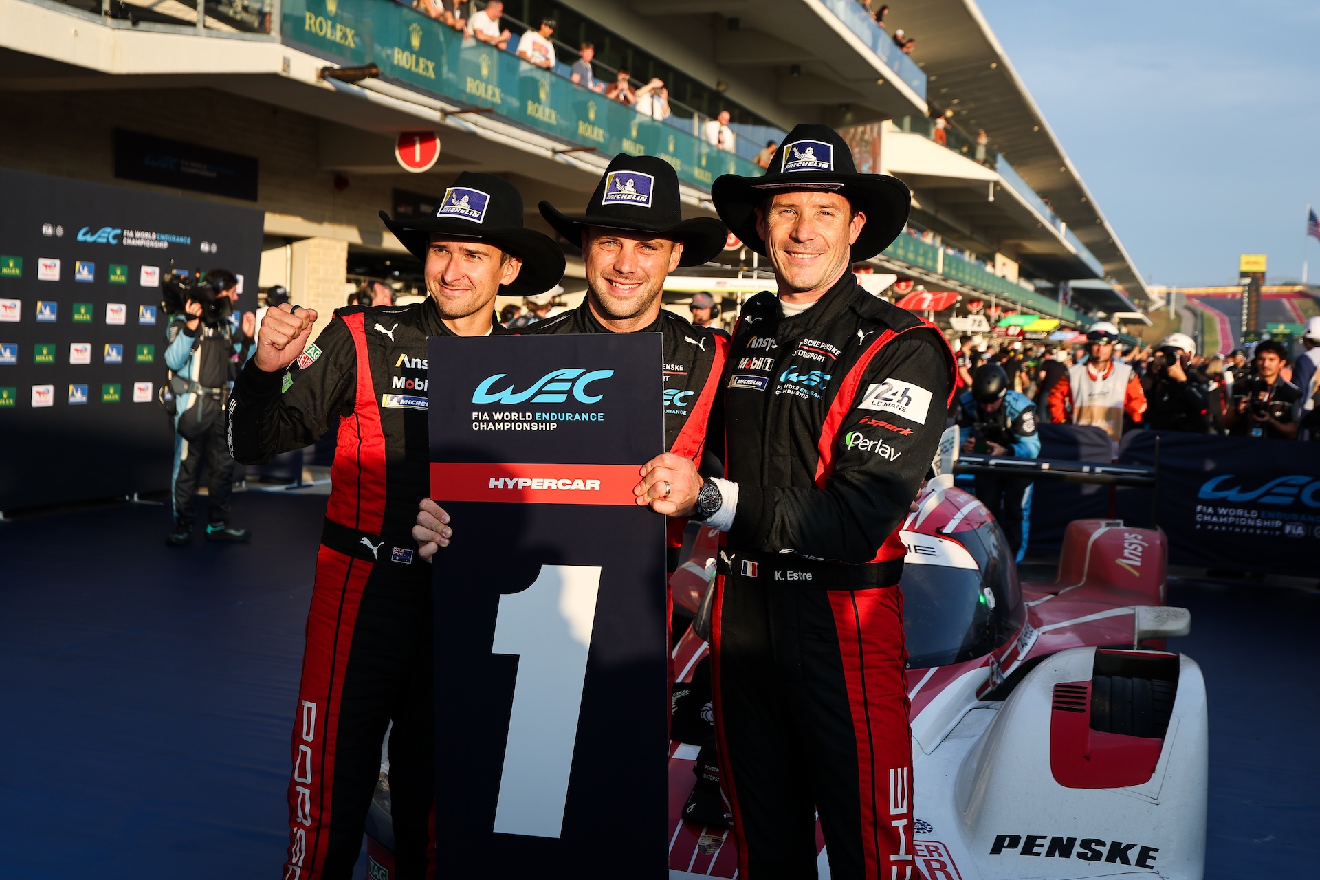 AUSTIN, TEXAS - SEPTEMBER 07: (L to R): Hypercar race winners, #06 Porsche Penske Motorsport, Porsche 963 drivers Matt Campbell, Laurens Vanthoor, and Kevin Estre, celebrate in parc ferme during the FIA WEC Lonestar Le Mans race at the Circuit of The Americas on September 07, 2025 in Austin, Texas. (Photo by James Moy Photography/Getty Images)