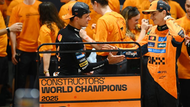 SINGAPORE, SINGAPORE - OCTOBER 05: Lando Norris of Great Britain and McLaren and Oscar Piastri of Australia and McLaren celebrate with their team after winning the Constructors Championship during the F1 Grand Prix of Singapore at Marina Bay Street Circuit on October 05, 2025 in Singapore, Singapore. (Photo by Clive Mason/Getty Images)