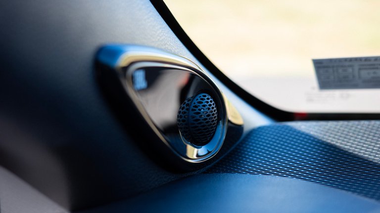 A JBL tweeter speaker in a Toyota Corolla hatchback