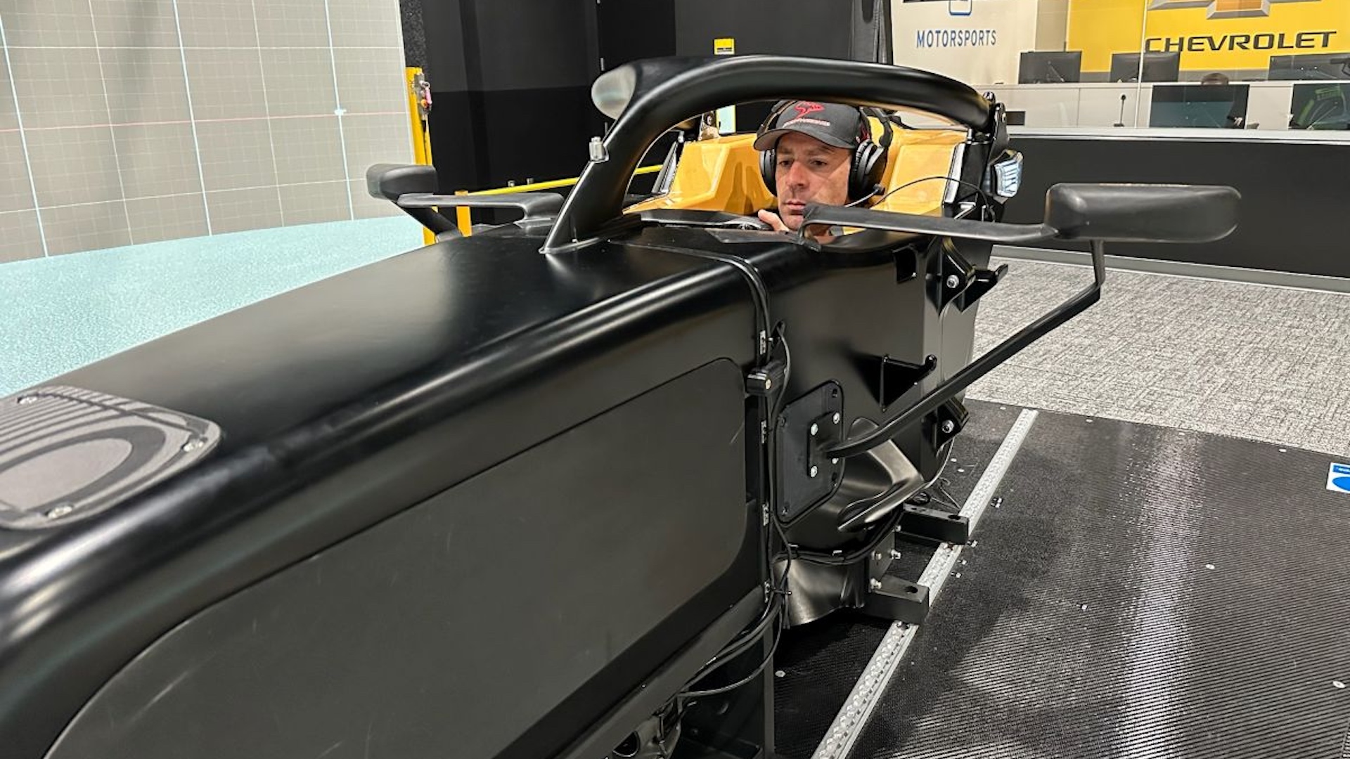 Simon Pagenaud in a racing sim cockpit