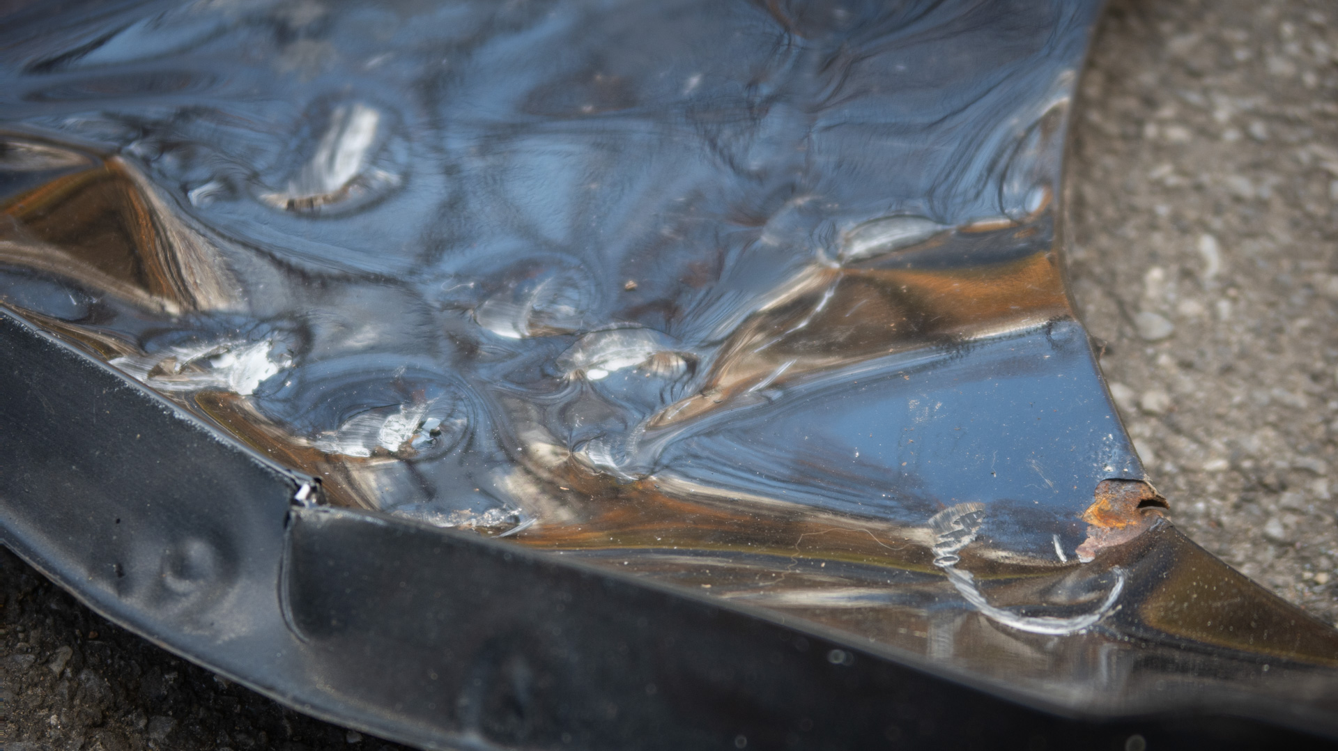 Smashed up car fender.