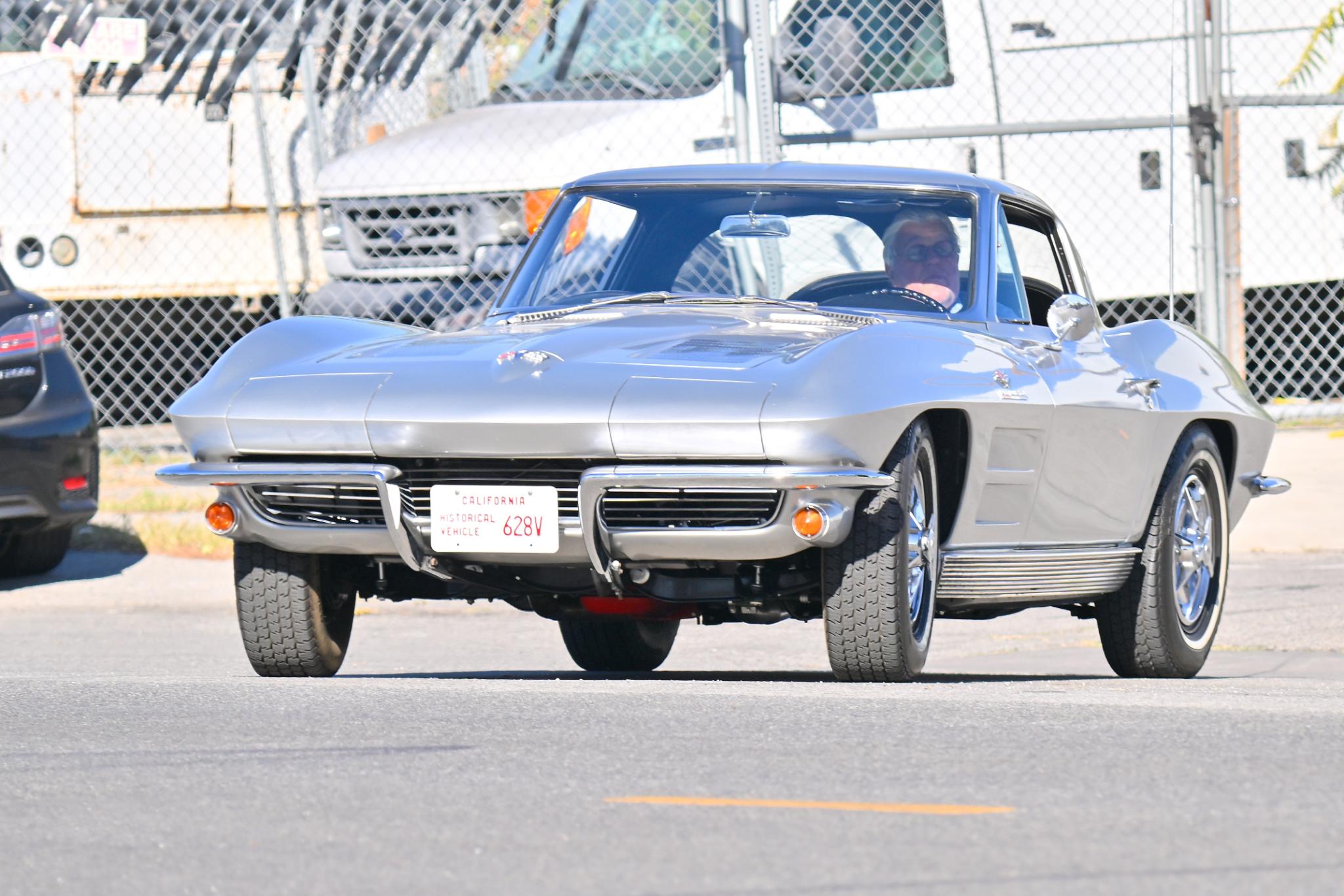 Jay Leno in a 1963 Chevy Corvette Stingray