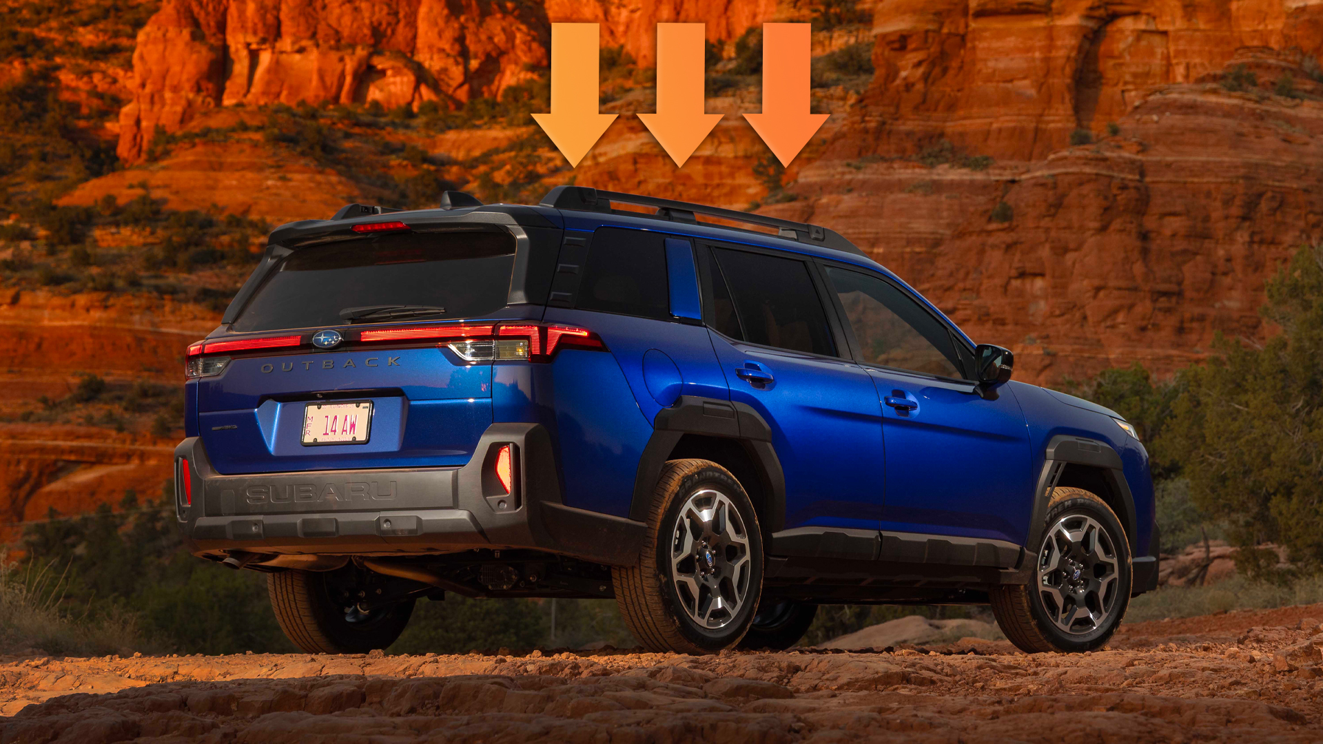 Subaru Outback in blue from the back.