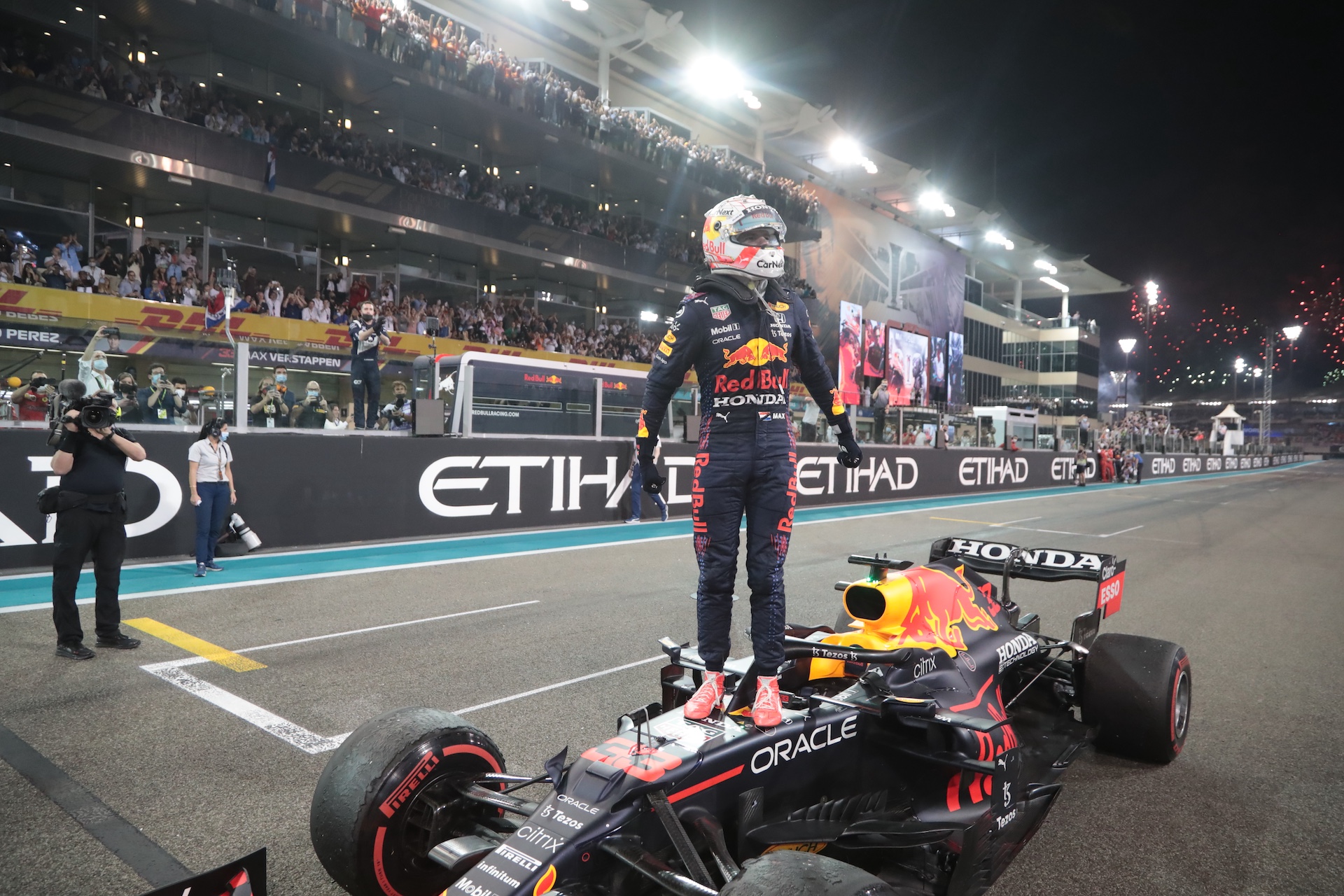 ABU DHABI, UNITED ARAB EMIRATES - DECEMBER 12: Celebration with Max Verstappen after winning the F1 World Championship Title on the finish line during the Grand Prix Formula 1 of Abu Dhabi, at Yas Marina Circuit on December 12, 2021 in Abu Dhabi, United Arab Emirates. (Photo by Steve Domenjoz ATPImages/Getty Images)