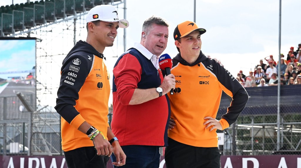 NORTHAMPTON, ENGLAND - JULY 03: Lando Norris of Great Britain and McLaren and Oscar Piastri of Australia and McLaren are interviewed by David Croft during previews ahead of the F1 Grand Prix of Great Britain at Silverstone Circuit on July 03, 2025 in Northampton, England. (Photo by Mark Sutton - Formula 1/Formula 1 via Getty Images)