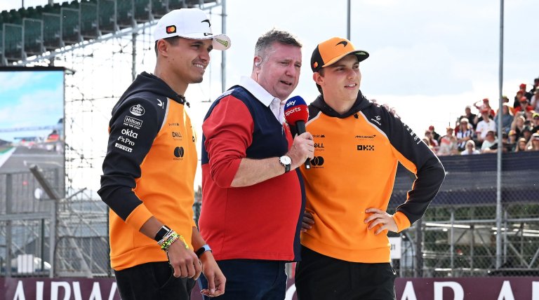 NORTHAMPTON, ENGLAND - JULY 03: Lando Norris of Great Britain and McLaren and Oscar Piastri of Australia and McLaren are interviewed by David Croft during previews ahead of the F1 Grand Prix of Great Britain at Silverstone Circuit on July 03, 2025 in Northampton, England. (Photo by Mark Sutton - Formula 1/Formula 1 via Getty Images)