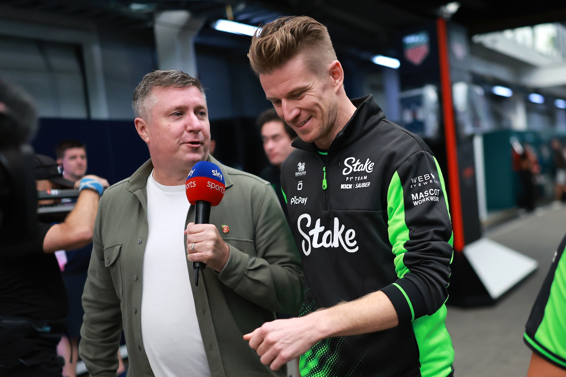 SAO PAULO, BRAZIL - NOVEMBER 06: Nico Hulkenberg of Germany and Stake F1 Team Kick Sauber is interviewed by David Croft as he walks in the Paddock during previews ahead of the F1 Grand Prix of Brazil at Autodromo Jose Carlos Pace on November 06, 2025 in Sao Paulo, Brazil. (Photo by Hector Vivas/Getty Images)