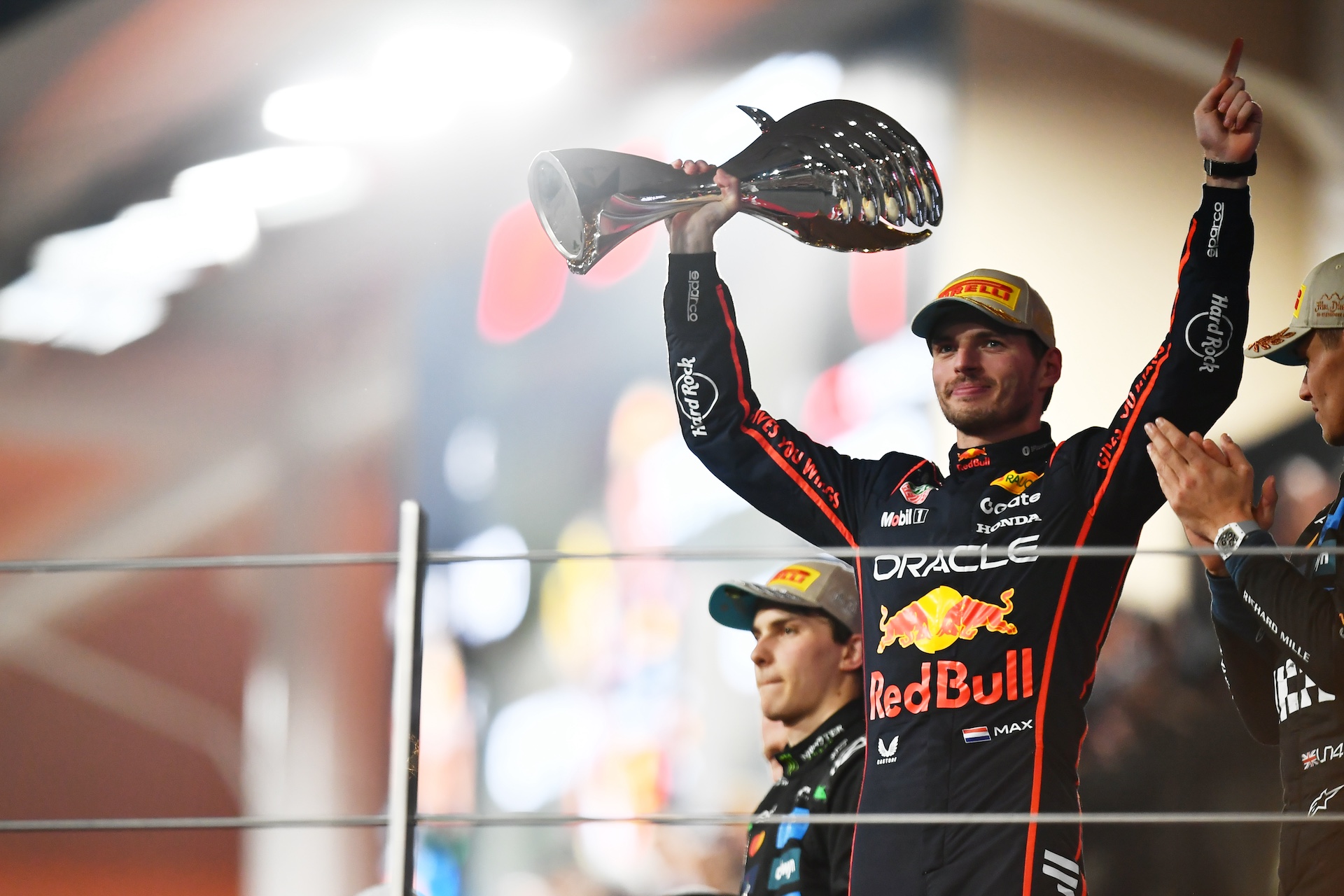 ABU DHABI, UNITED ARAB EMIRATES - DECEMBER 07: Race winner Max Verstappen of the Netherlands and Oracle Red Bull Racing celebrates on the podium during the F1 Grand Prix of Abu Dhabi at Yas Marina Circuit on December 07, 2025 in Abu Dhabi, United Arab Emirates. (Photo by James Sutton - Formula 1/Formula 1 via Getty Images)