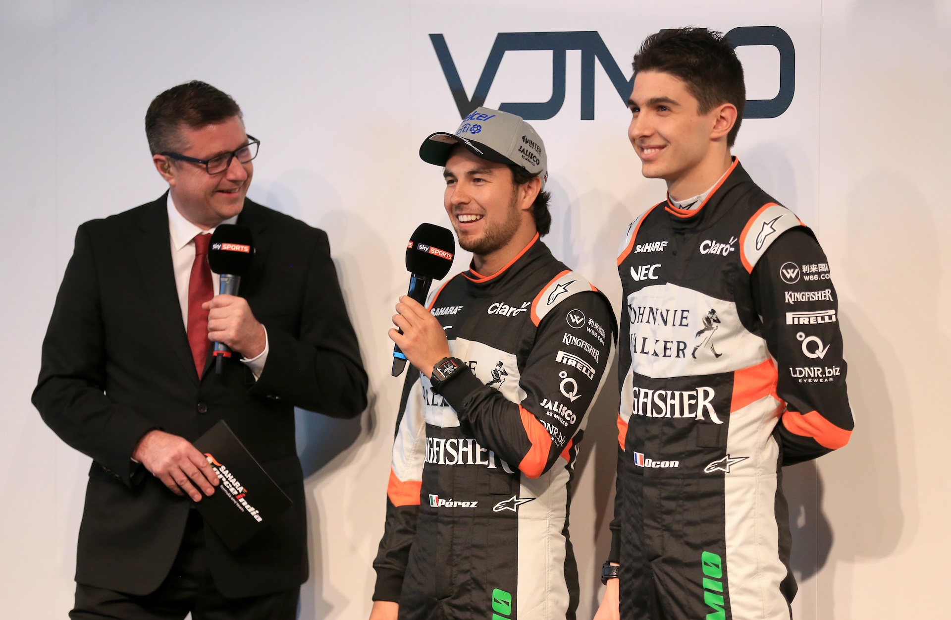 Sky Sports commentator David Croft (left) alongside Sahara Force India drivers Sergio Perez (left) and Esteban Ocon during the Force India 2017 Car Launch at Silverstone, Towcester. (Photo by Nigel French/PA Images via Getty Images)