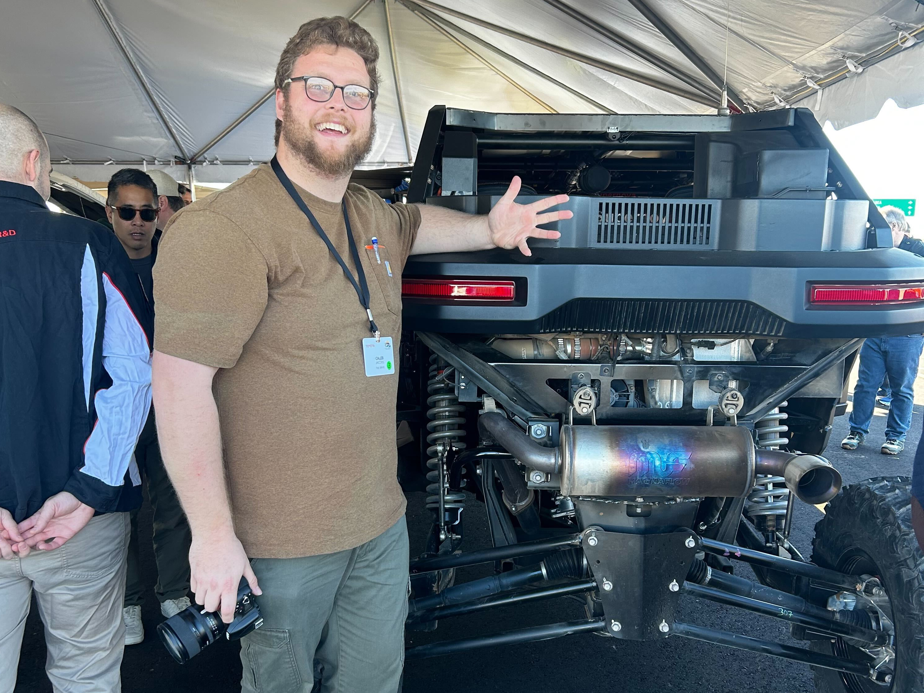 6'5" man with Scion 01 UTV