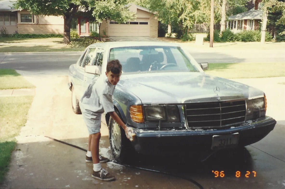 Joel Feder washing the 1991 Mercedes-Benz 350 SDL