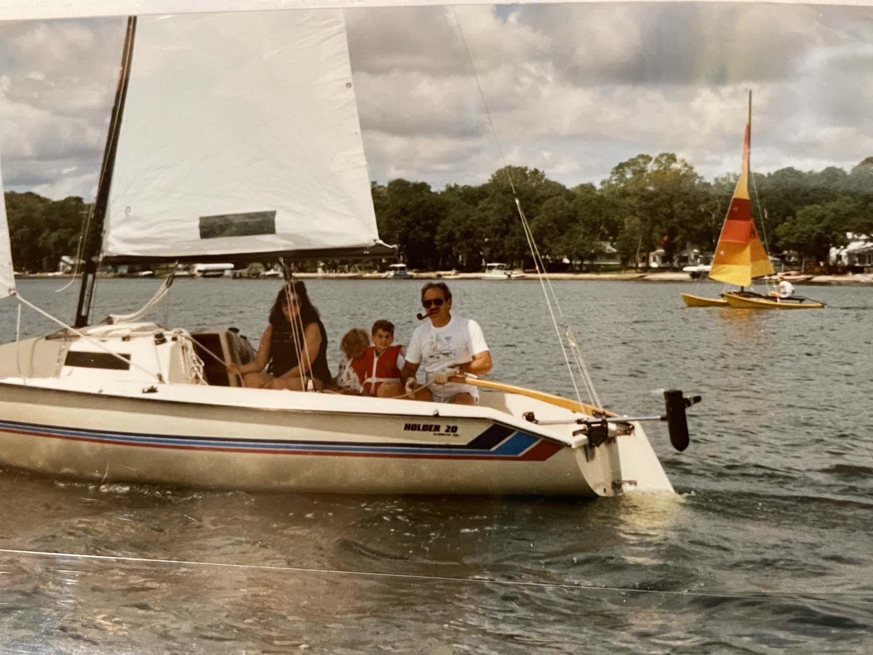 Unc, Aunt Jan, Hannah Feder, and Joel Feder in the Holder 17 sailboat