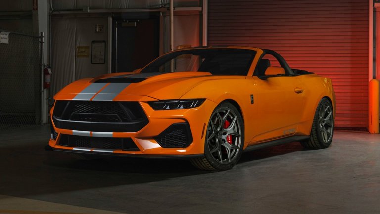 Orange Shelby Mustang in a garage